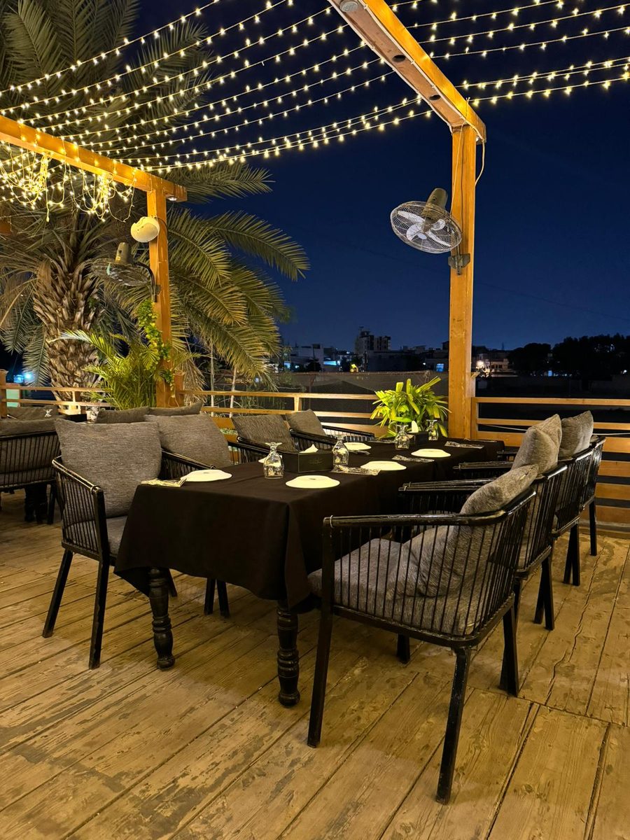 Open-air dining beneath the evening lights